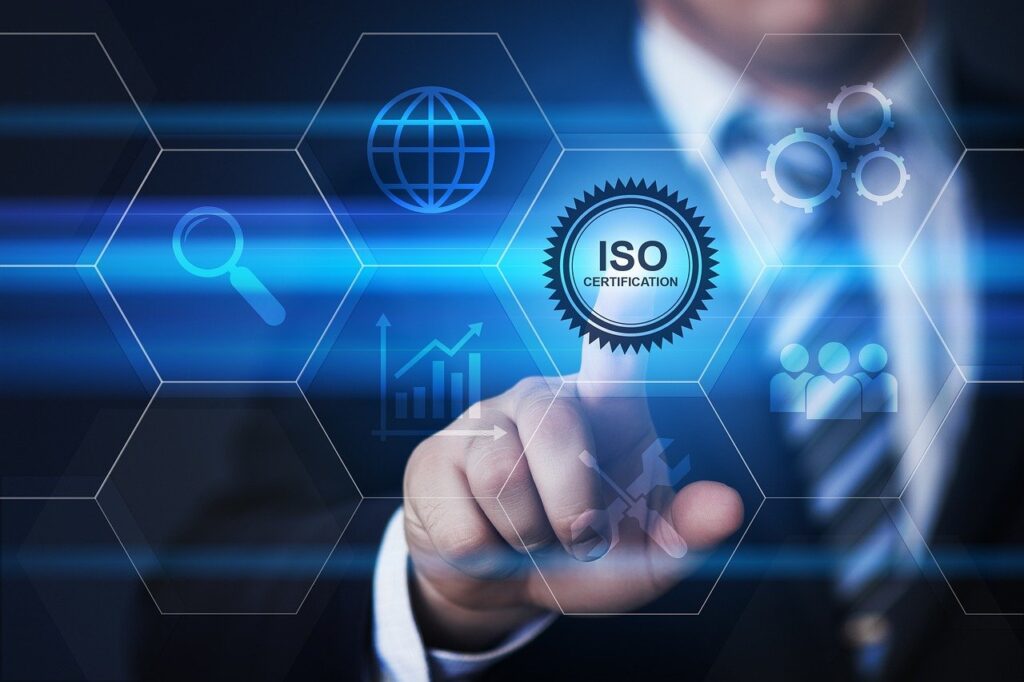 man pointing at ISO certification icon on a grid
